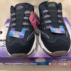 Skechers, size 11 women’s slip on sneakers.